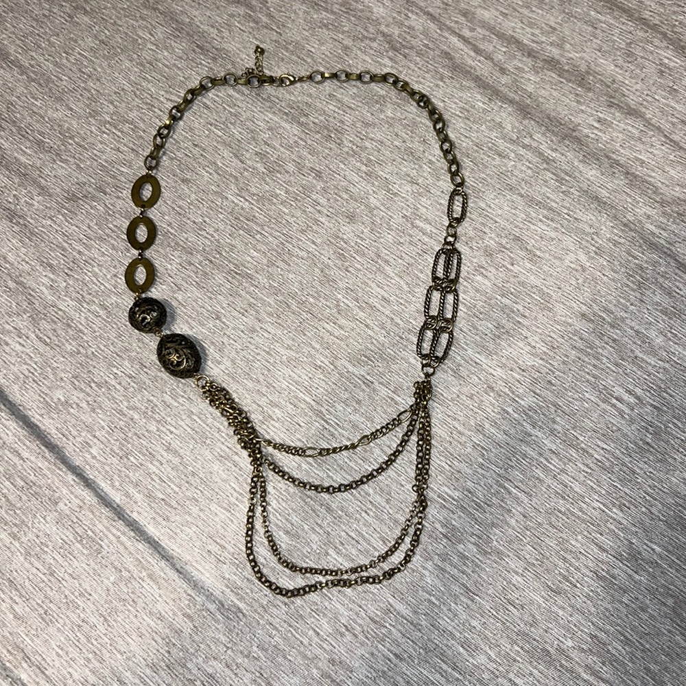 Woman’s bronze colored necklace